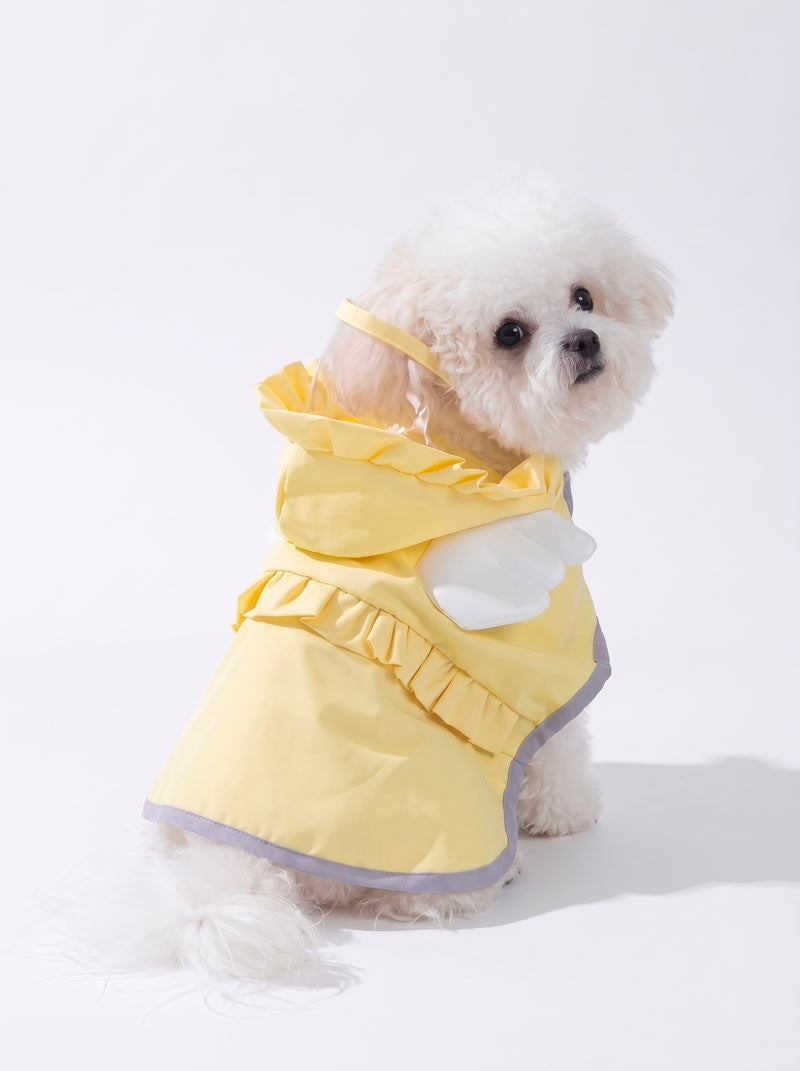 Small poodle in the Angel Drops yellow dog raincoat, side view with clear visor, angel wings and reflective trim - Malpetit