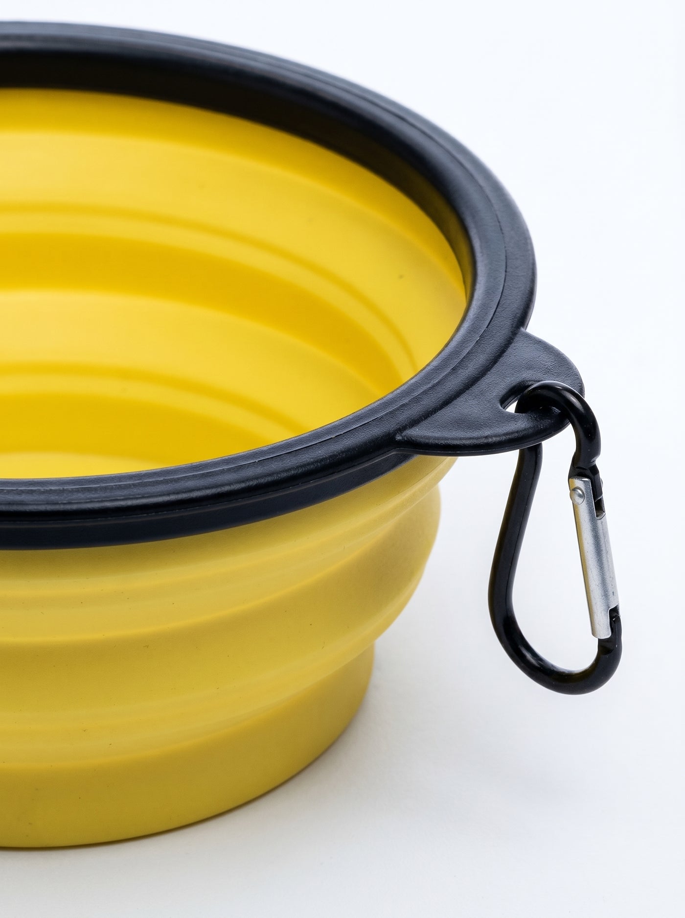 Yellow foldable travel bowl carabiner clip close-up – Malpetit